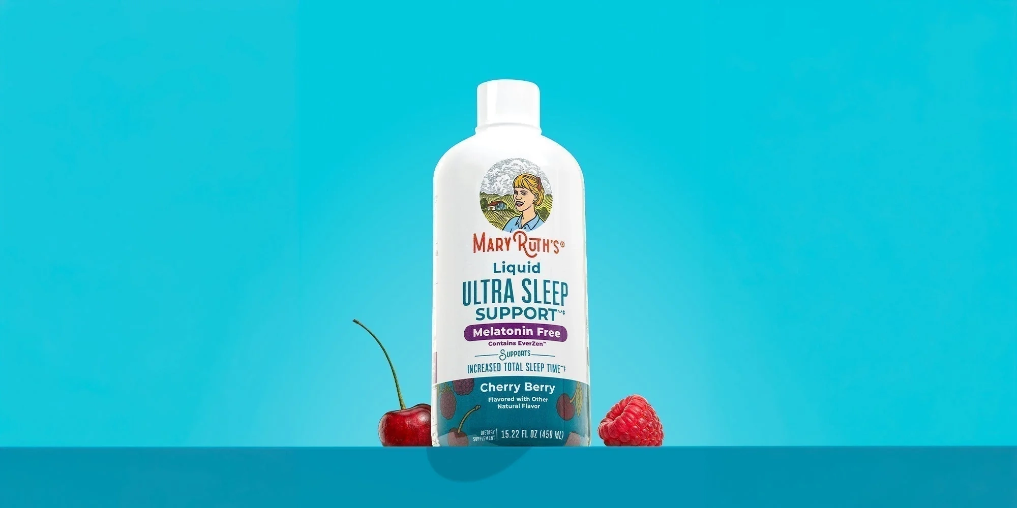 Liquid Ultra Sleep Support bottle on a bright blue set with cherries