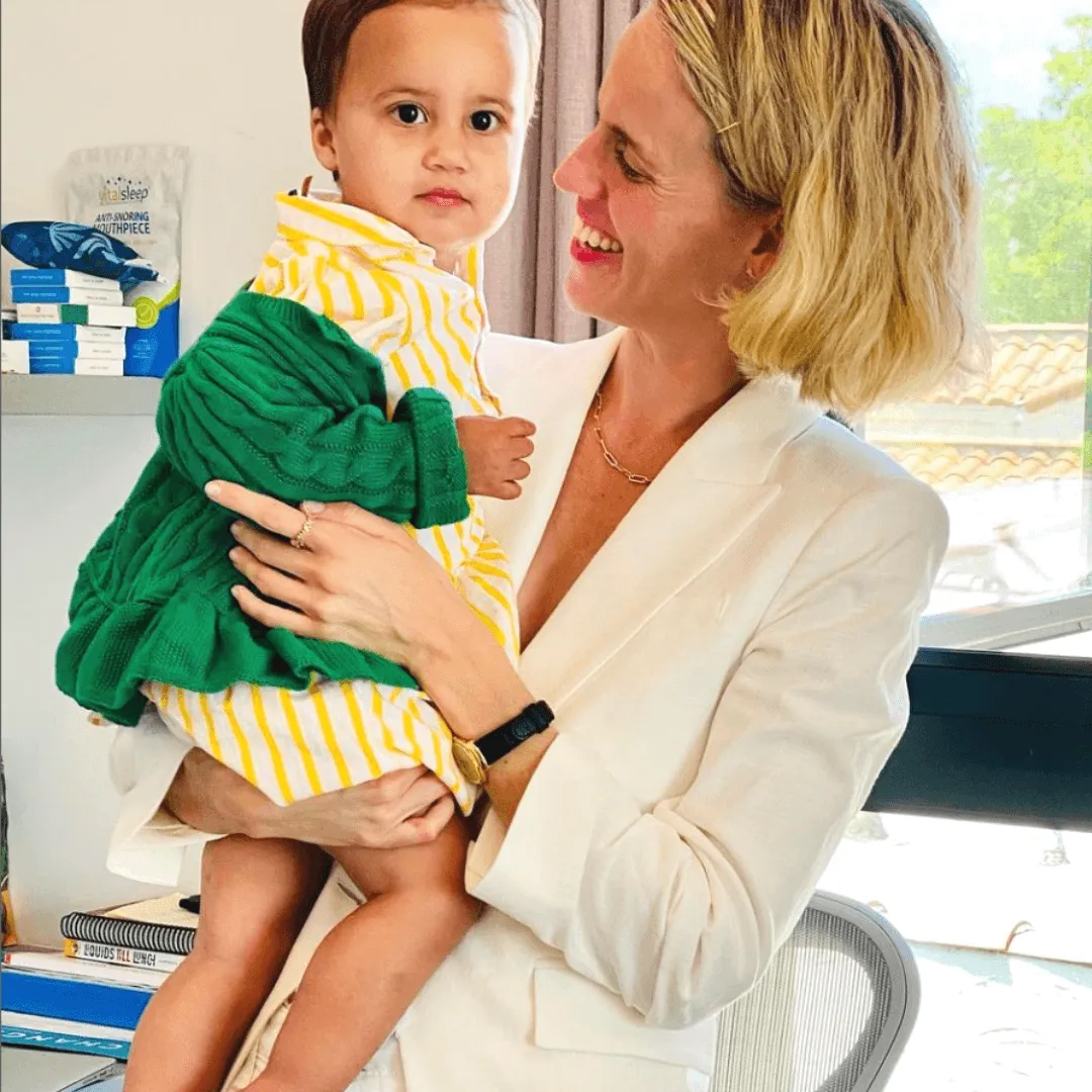 Instagram post: a mother holding a toddler